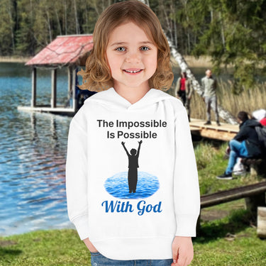 Rabbit Skins toddler fleece hoodie with “Impossible Toddler” design and faith-filled message, soft cotton-poly blend, durable stitching, Christian apparel for active toddlers and spiritual encouragement, toddler girl in white hoodie